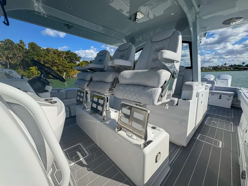 Slide: The Image of 2024 HCB 53' Suenos luxury boat interior with plush seating and modern design. - 27