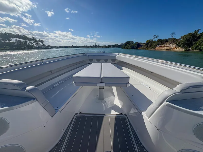 Slide: The Image of 2024 HCB 53' Suenos boat interior with seating, on a sunny day. - 35