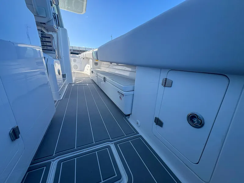 Slide: The Image of 2024 HCB 53' Suenos boat deck with sleek design and storage compartments. - 40