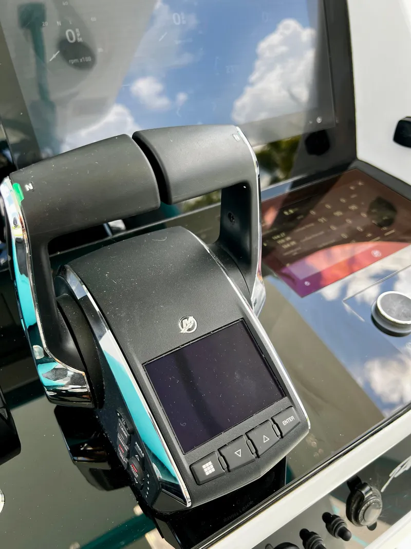 Slide: The Image of Renegade 38 Open 2021 boat throttle control with digital display and reflections. - 15