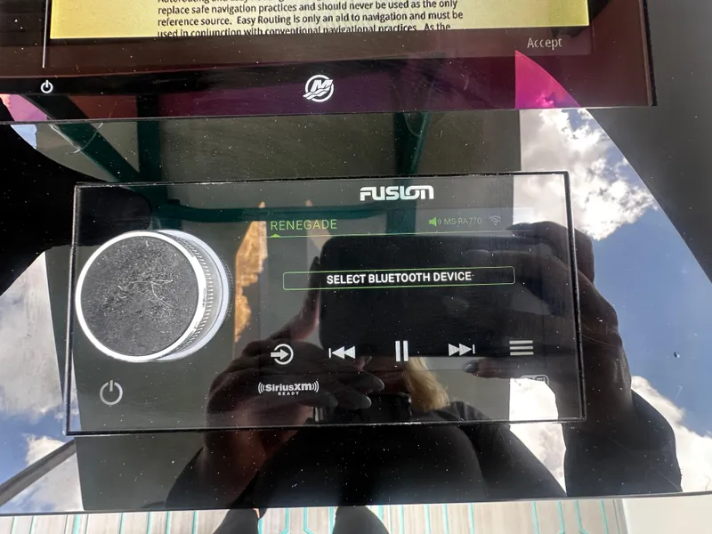 Slide: The Image of Fusion audio system in a 2021 Renegade 38 Open, displaying Bluetooth device selection. - 17