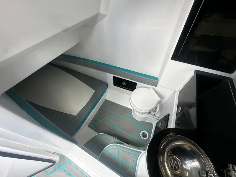 Slide: The Image of Interior of 2021 Renegade 38 Open boat with modern amenities and sleek design. - 19