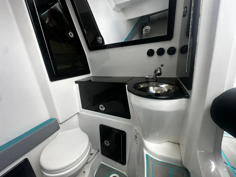 Slide: The Image of 2021 Renegade 38 Open boat bathroom with modern sink and toilet. - 20