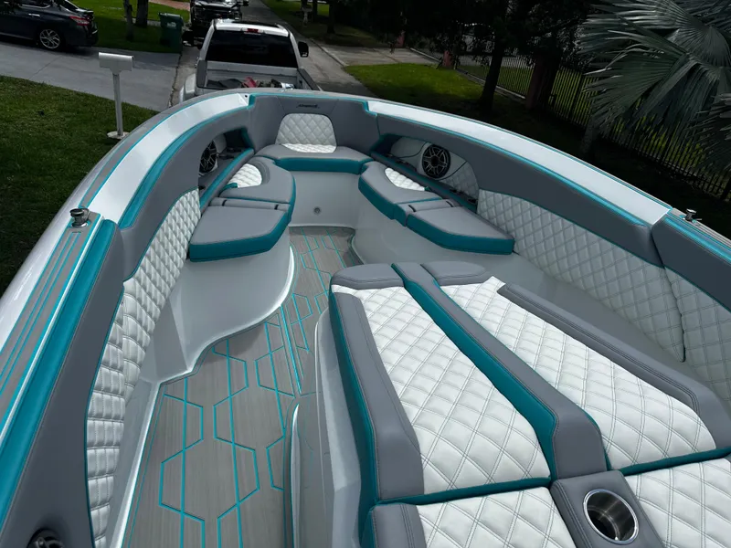 Slide: The Image of 2021 Renegade 38 Open boat interior with white and teal seating, modern design. - 28