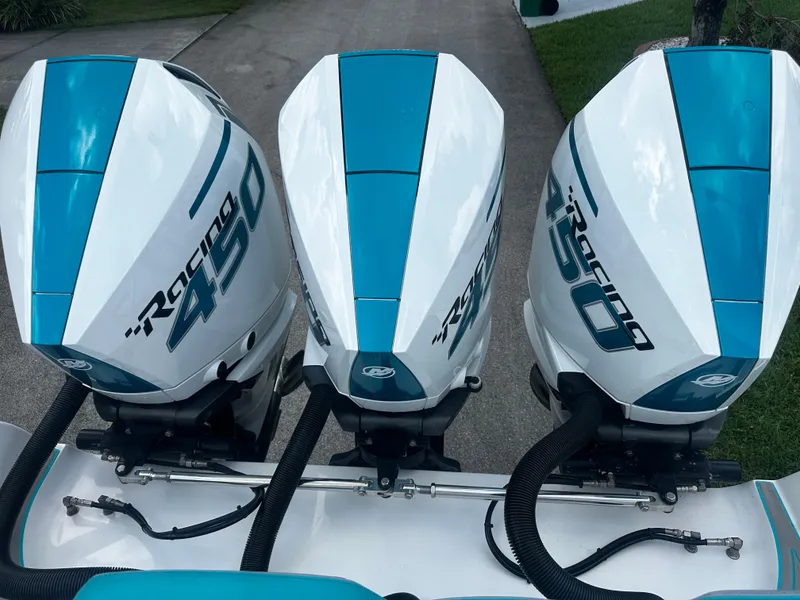 Slide: The Image of Triple Mercury Racing 450R engines on 2021 Renegade 38 Open boat. - 5