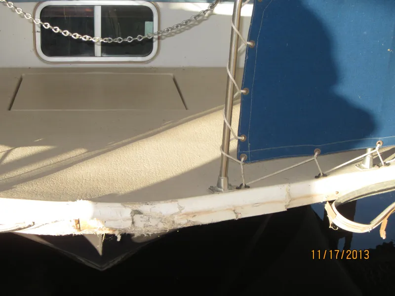 Slide: The Image of 1976 Harbor Master houseboat with blue canopy and chain railing, photographed on 11/17/2013. - 11