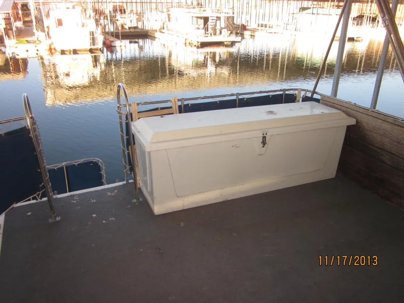 Slide: The Image of 1976 Harbor Master houseboat deck with storage box, overlooking marina. - 6