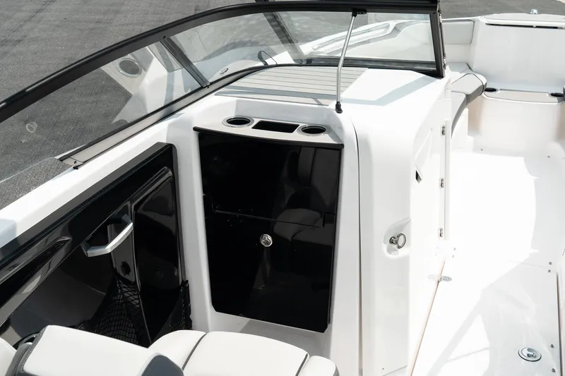 Slide: The Image of 2024 Yamaha AR250 boat interior with sleek seating and modern dashboard design. - 12