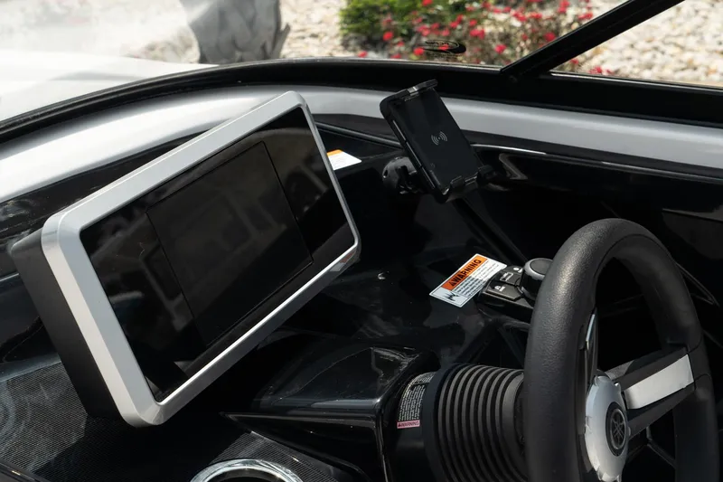 Slide: The Image of 2024 Yamaha AR250 boat dashboard with steering wheel and digital display. - 15