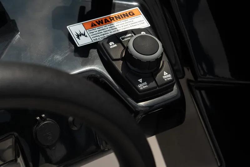 Slide: The Image of Close-up of 2024 Yamaha AR250 boat control panel with warning label. - 16