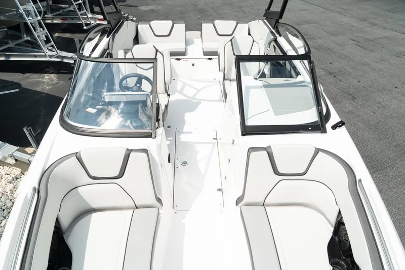 Slide: The Image of 2024 Yamaha Boats AR250 interior with sleek seating and modern design. - 17