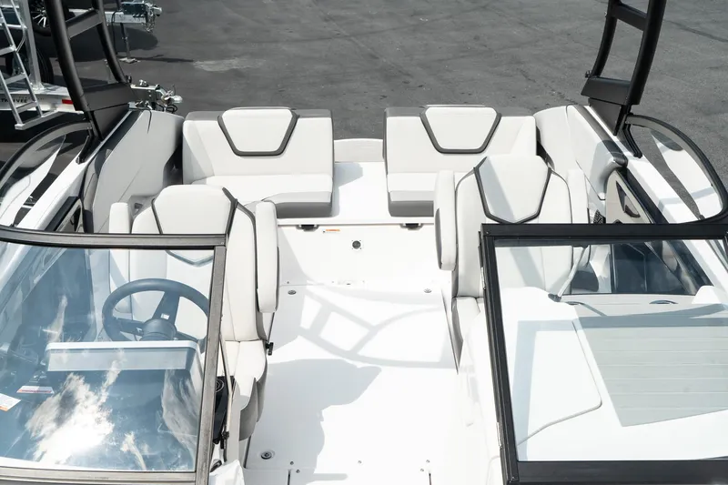 Slide: The Image of 2024 Yamaha Boats AR250 interior with sleek seating and modern design. - 19
