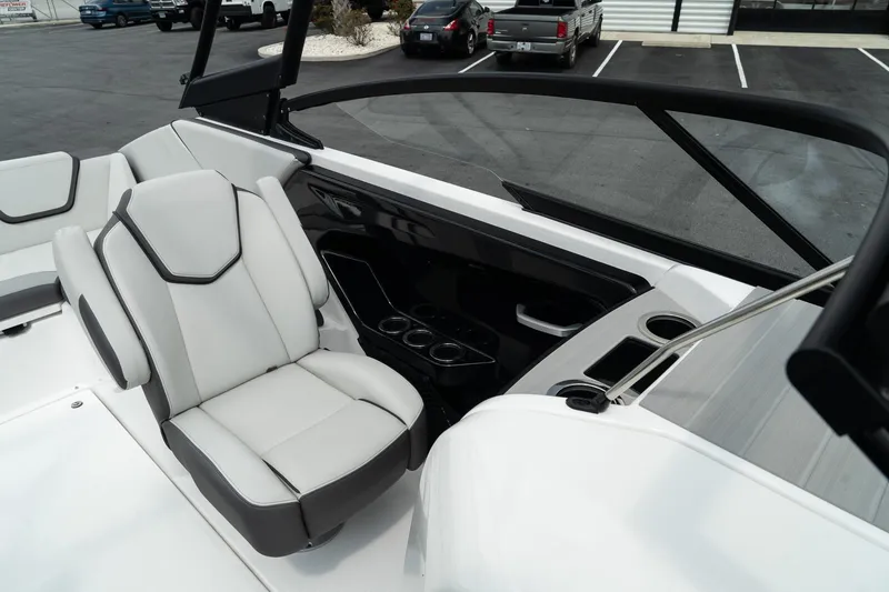 Slide: The Image of 2024 Yamaha Boats AR250 interior with sleek seating and modern dashboard design. - 20