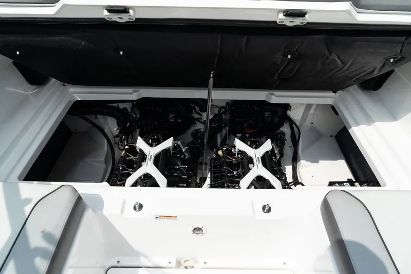 Slide: The Image of 2024 Yamaha AR250 boat engine compartment with dual engines. - 21