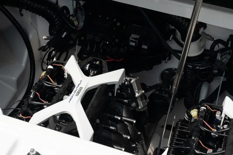 Slide: The Image of 2024 Yamaha AR250 engine compartment with visible components and wiring. - 24