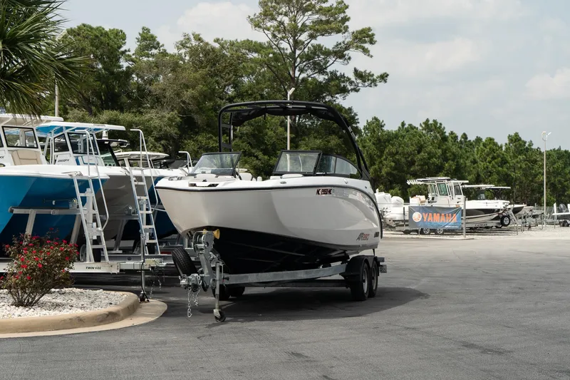 Slide: The Image of 2024 Yamaha AR250 boat on trailer in marina parking lot. - 3