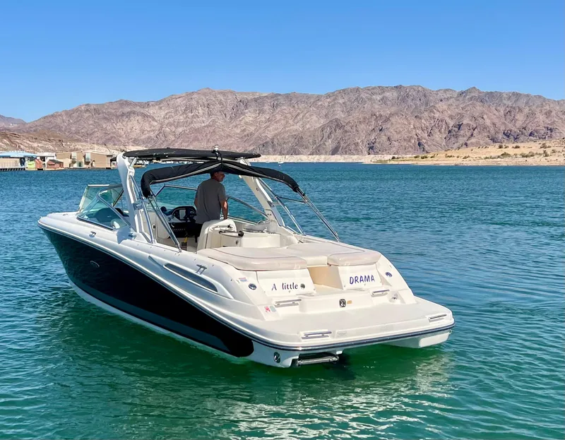 Slide: The Image of 2008 Sea Ray 270 SLX boat on a lake with mountainous backdrop. - 11