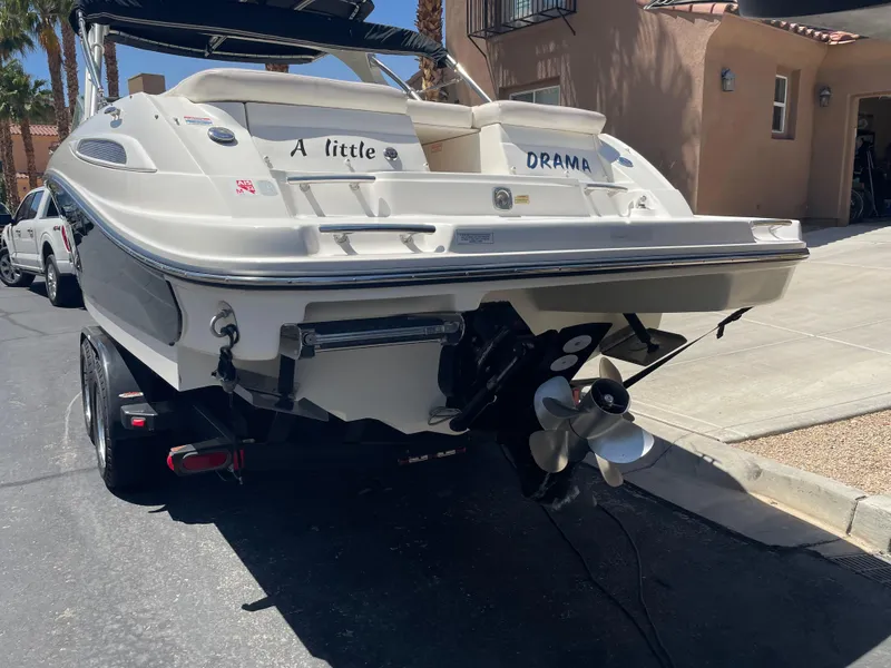 Slide: The Image of 2008 Sea Ray 270 SLX boat on trailer, rear view, labeled "A little DRAMA." - 13