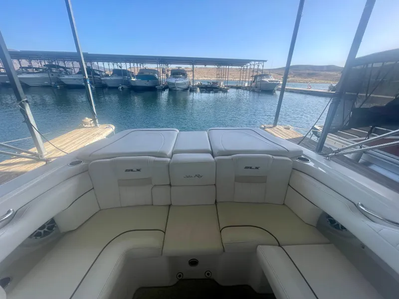 Slide: The Image of 2008 Sea Ray 270 SLX boat interior with docked boats in the background. - 19