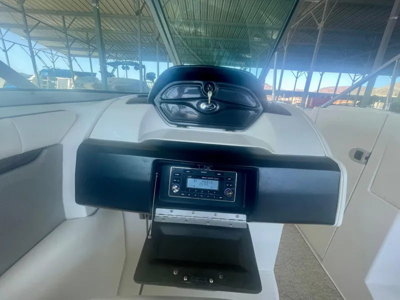 Slide: The Image of 2008 Sea Ray 270 SLX dashboard with stereo system and sleek design. - 22