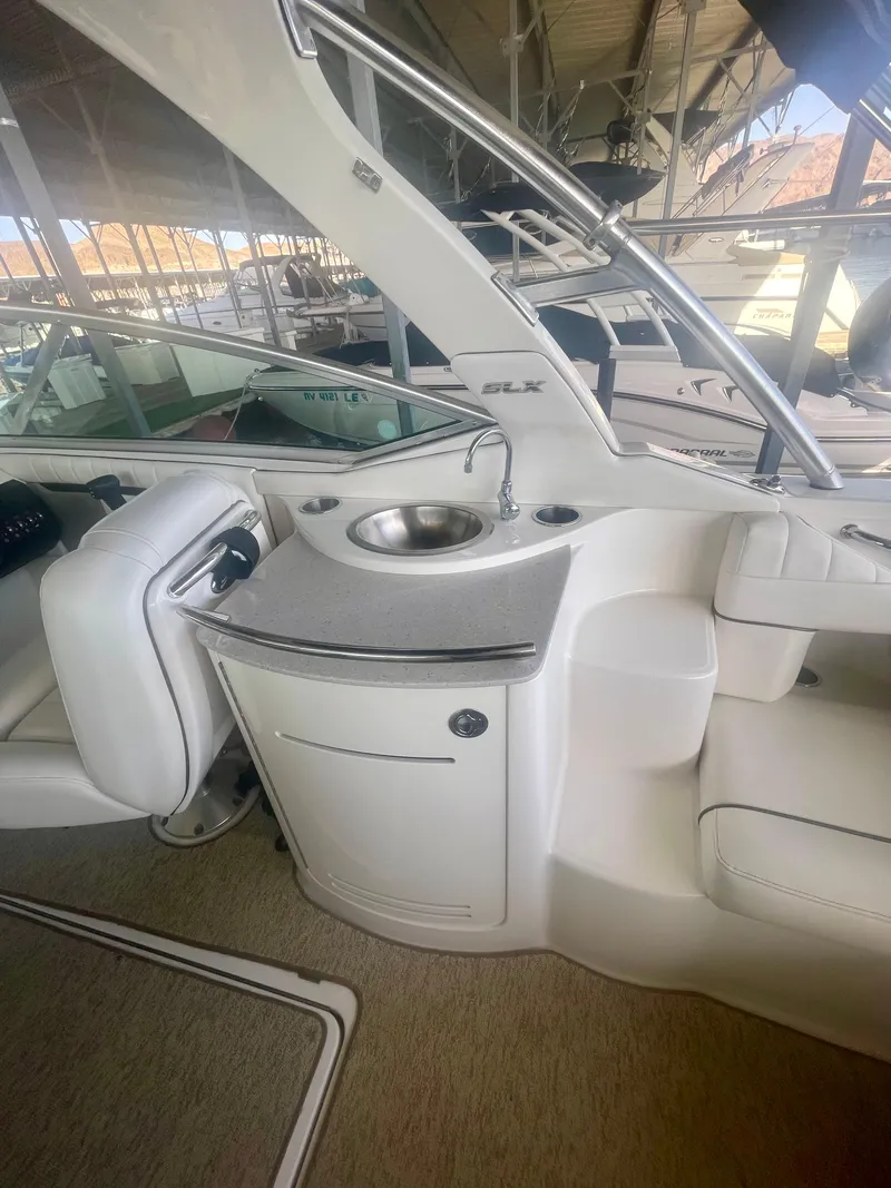 Slide: The Image of 2008 Sea Ray 270 SLX boat interior with sink and seating area. - 25