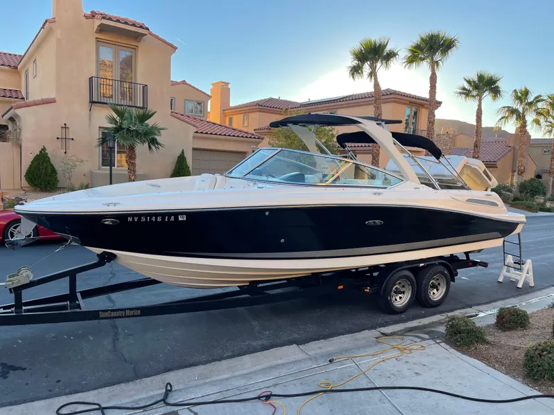 Slide: The Image of 2008 Sea Ray 270 SLX boat on trailer in residential area. - 3
