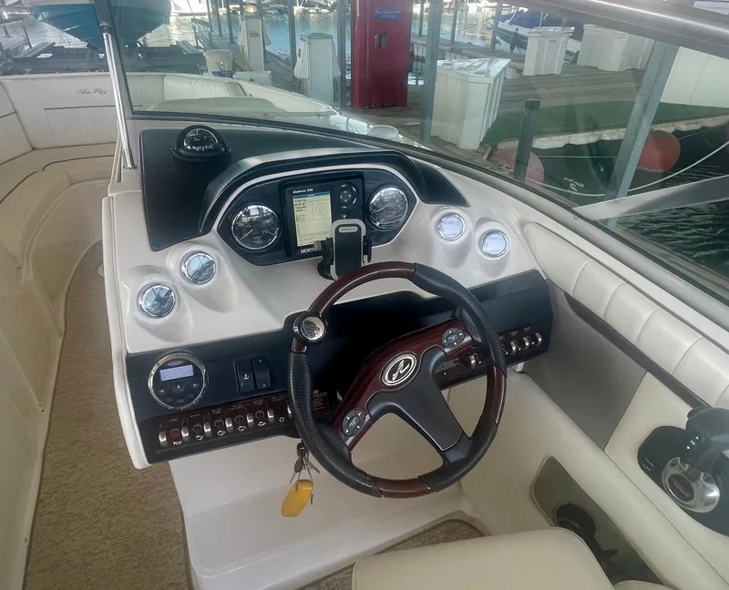 Slide: The Image of 2008 Sea Ray 270 SLX boat dashboard with steering wheel and instrument panel. - 31