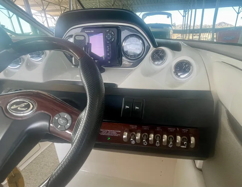 Slide: The Image of Dashboard of 2008 Sea Ray 270 SLX boat with steering wheel and control panel. - 33