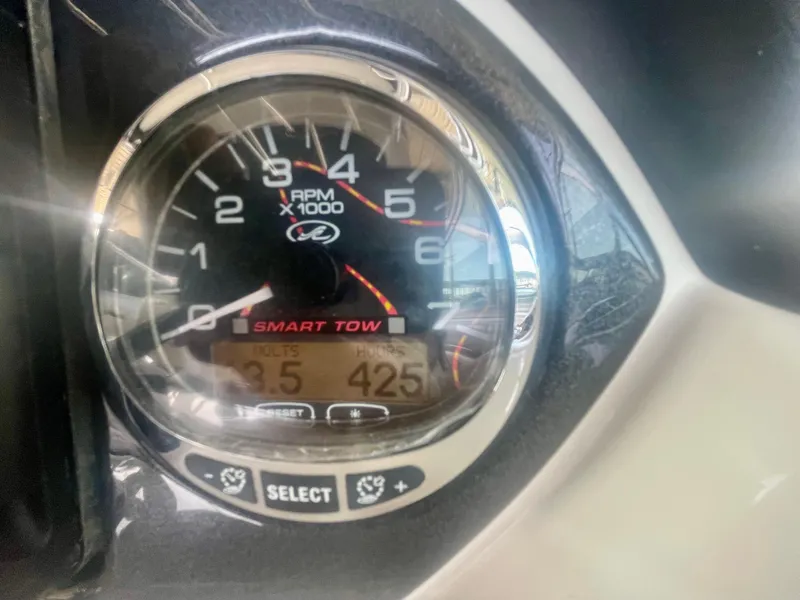 Slide: The Image of Close-up of 2008 Sea Ray 270 SLX tachometer displaying RPM and Smart Tow settings. - 34