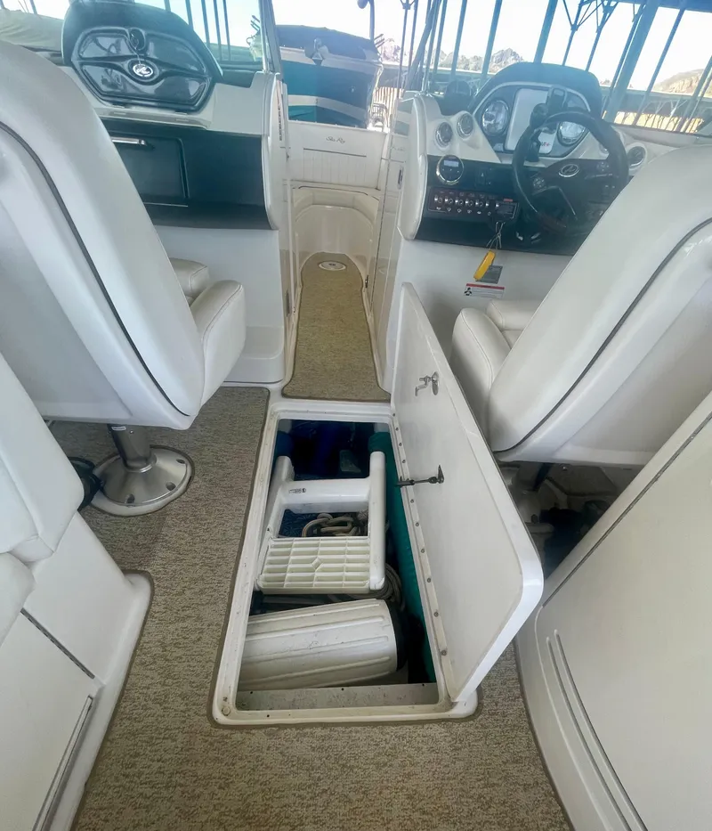 Slide: The Image of 2008 Sea Ray 270 SLX boat interior with open storage compartment. - 35