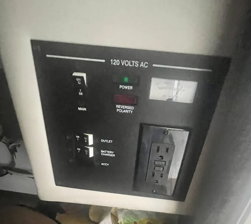 Slide: The Image of Control panel of a 2008 Sea Ray 270 SLX boat, showing 120 volts AC system. - 38