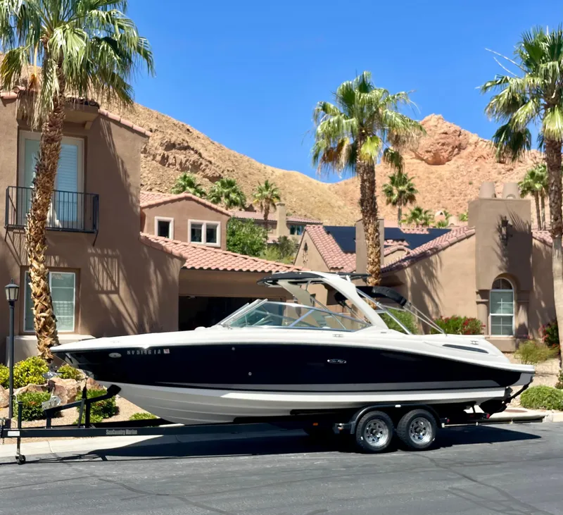 Slide: The Image of 2008 Sea Ray 270 SLX boat on trailer in suburban desert setting. - 4