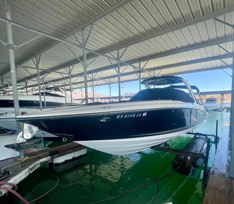 Slide: The Image of 2008 Sea Ray 270 SLX boat docked under covered marina. - 5
