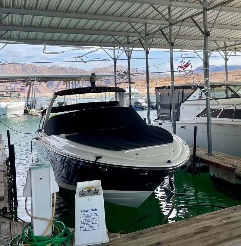 Slide: The Image of 2008 Sea Ray 270 SLX docked in a covered marina. - 7