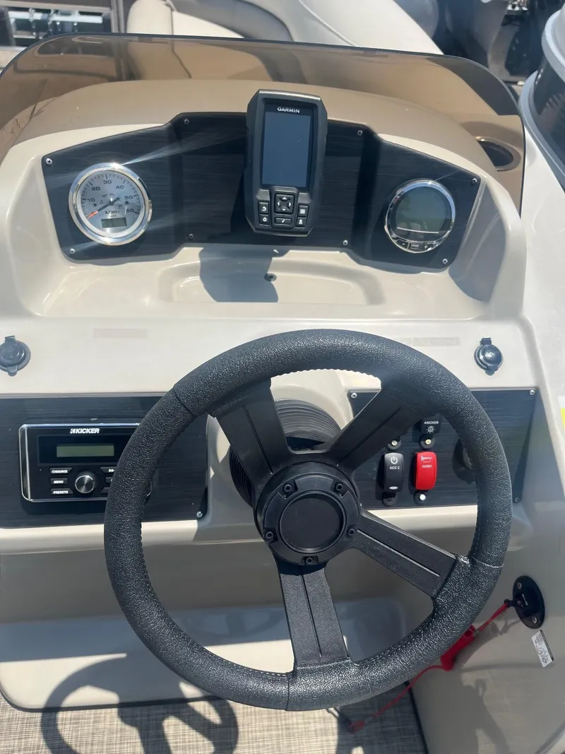 Slide: The Image of 2022 Cypress Cay Seabreeze 232 dashboard with steering wheel and gauges. - 7