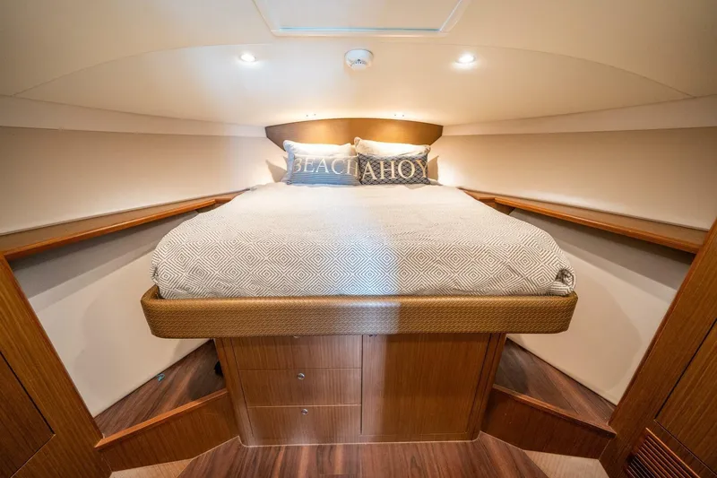 Slide: The Image of Luxurious cabin interior of 2020 Cabo 40 Express yacht with cozy bedding. - 12