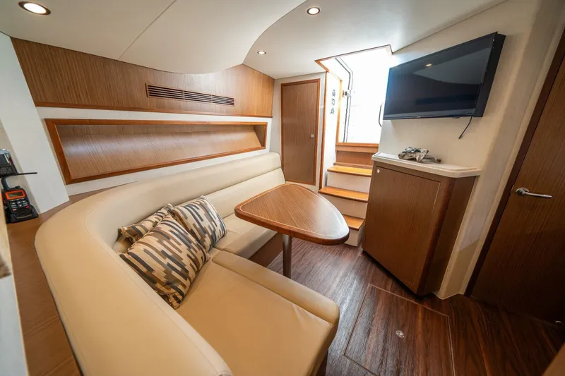 Slide: The Image of Luxurious interior of 2020 Cabo 40 Express yacht with seating, table, and TV. - 14
