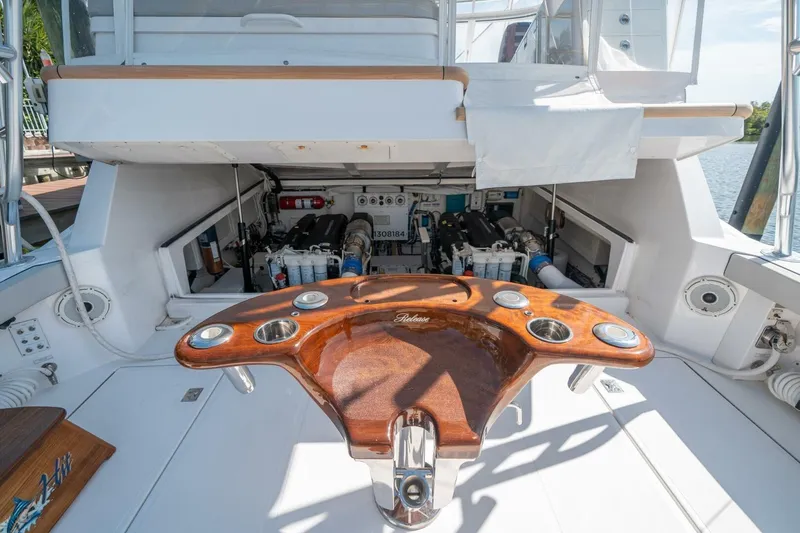 Slide: The Image of Engine compartment of 2020 Cabo 40 Express yacht with wooden fishing station. - 18