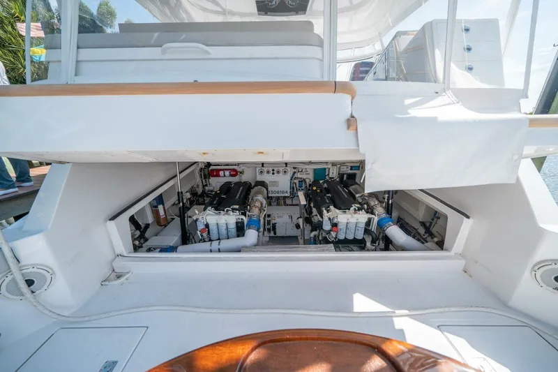 Slide: The Image of Engine compartment of 2020 Cabo 40 Express yacht, showcasing detailed mechanical components. - 20