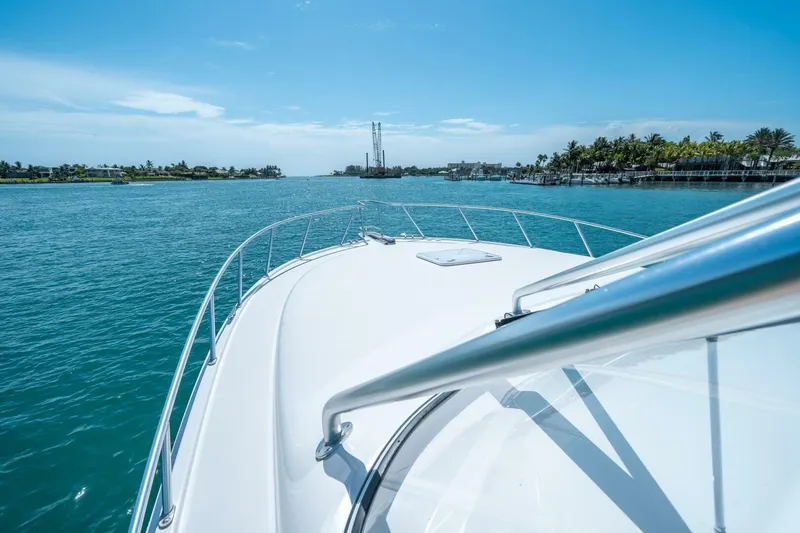 Slide: The Image of Bow view of 2020 Cabo 40 Express yacht cruising on a sunny day. - 31
