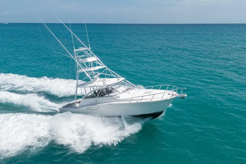 Slide: The Image of 2020 Cabo 40 Express yacht cruising on open ocean waters. - 4