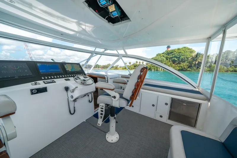 Slide: The Image of Helm of 2020 Cabo 40 Express yacht with scenic ocean view. - 46
