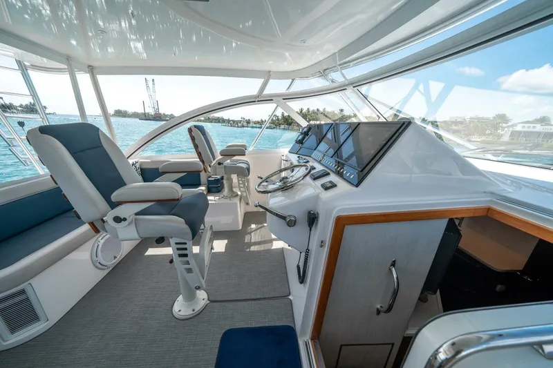 Slide: The Image of Interior of 2020 Cabo 40 Express yacht with modern helm and seating. - 52
