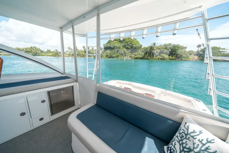 Slide: The Image of Interior view of 2020 Cabo 40 Express yacht with scenic water backdrop. - 56