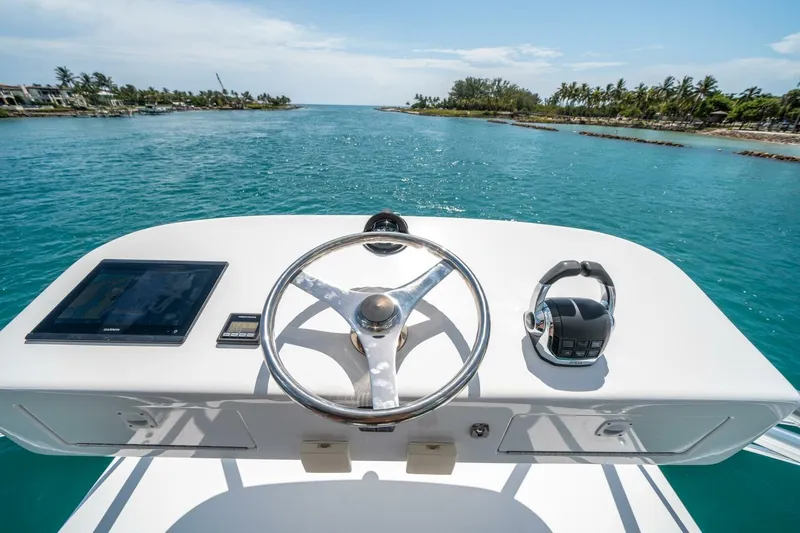 Slide: The Image of Helm of 2020 Cabo 40 Express yacht with ocean view and clear skies. - 59