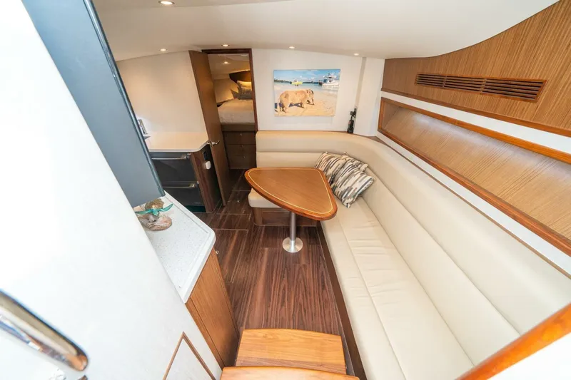 Slide: The Image of Luxurious interior of 2020 Cabo 40 Express yacht with elegant seating and wooden accents. - 6