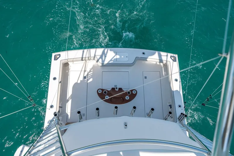 Slide: The Image of Aerial view of 2020 Cabo 40 Express boat deck on turquoise water. - 60