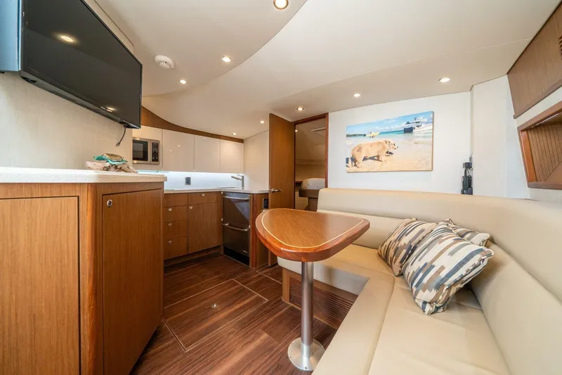 Slide: The Image of Luxurious interior of 2020 Cabo 40 Express yacht with modern kitchen and cozy seating area. - 8