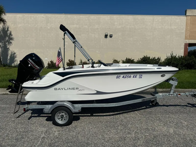 Slide: The Image of 2024 Bayliner Element M15 boat on trailer, parked outdoors. - 10