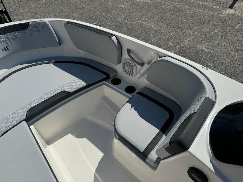 Slide: The Image of 2024 Bayliner Element M15 boat interior with gray seating and cup holders. - 13